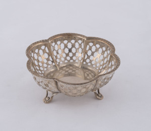 A George V sterling silver pierced fluted bowl raised on three scroll legs, by Snyder & Beddoes, Birmingham, circa 1928, 5cm high, 10cm diameter, 55 grams.