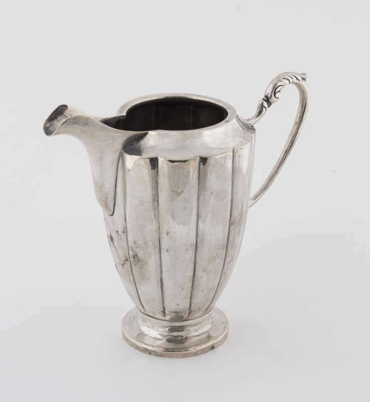 An Austro-Hungarian silver fluted jug, 20th century, 15cm high, 245 grams.