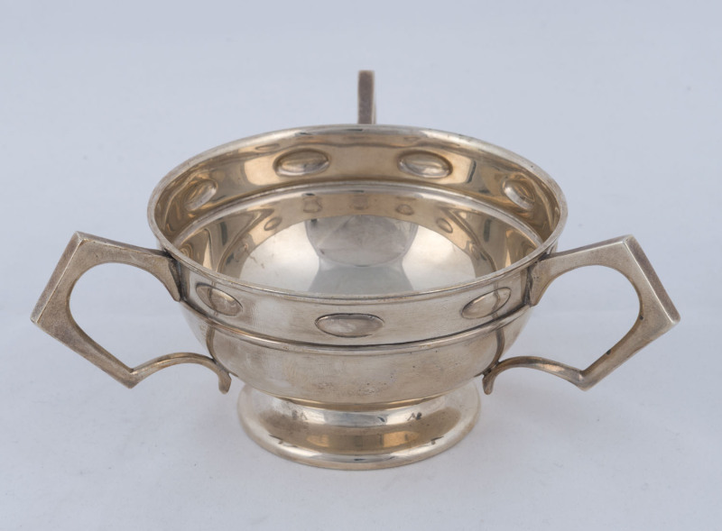 An Edward VII sterling silver three handled bowl, by William Hutton Co. Ltd., Birmingham, circa 1906, ​16cm across the handles, 180 grams.