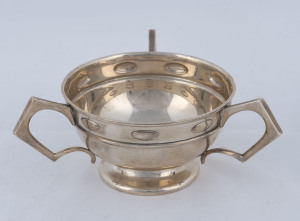 An Edward VII sterling silver three handled bowl, by William Hutton Co. Ltd., Birmingham, circa 1906, ​16cm across the handles, 180 grams.
