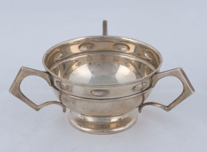 An Edward VII sterling silver three handled bowl, by William Hutton Co. Ltd., Birmingham, circa 1906, 16cm across the handles, 180 grams.