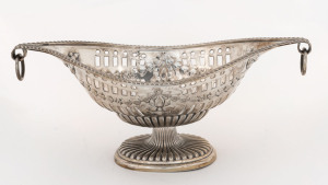 A George V sterling silver boat-shaped pierced bowl with two scrolling ring handles and embossed ribbon swags, by The Alexander Clark Manufacturing Co., London, circa 1927, 23.5cm across the handles, 225 grams.