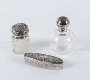 Three sterling silver topped vanity jars, 19th and 20th century, the tallest 11cm high