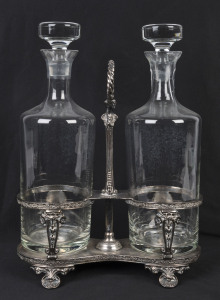 An English silver plated two bottle tantalus by Walker & Hall, circa 1900, decanters later and not associated, 31cm high
