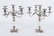 A pair of English 5 branch candelabra, silver plate, early 20th century, stamped "Silver Plated On Copper, Made In England", 40cm high