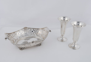 A sterling silver pierced oval serving dish by George Nathan & Ridley Hayes of Chester, circa 1902, 24.5cm across the handles; together with a pair of sterling silver vases, London mid 20th century, 13.5cm high, 620 grams total