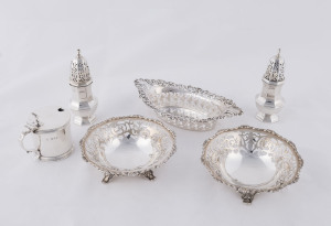 A pair of sterling silver condiments by Thomas Bradbury of London, circa 1899; together with a pair of pierced bonbon dishes, London, circa 1928, and a mustard pot, London, circa 1934. (6 items). 385 grams total