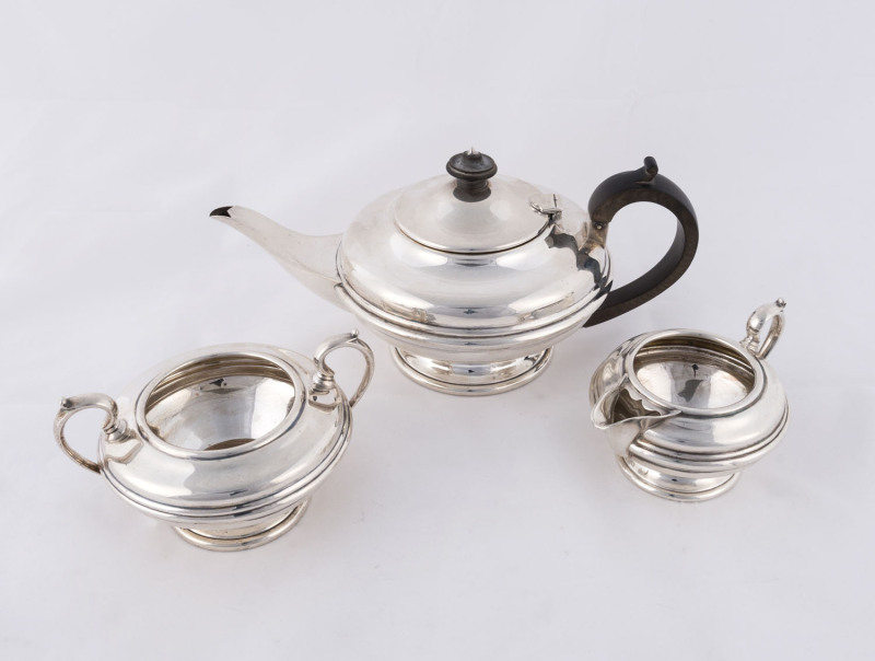 A three piece sterling silver tea service by Martin Hall & Co. Ltd. of Sheffield, circa 1870, ​the teapot 12cm high, 770 grams total