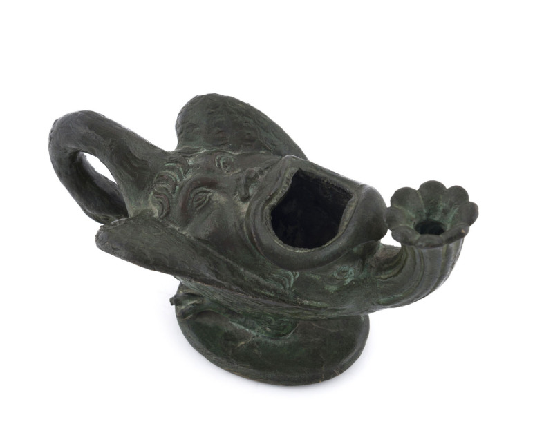 An antique oil lamp, cast bronze in the form of LEDA AND THE SWAN, 18th/19th century, ​15.5cm across