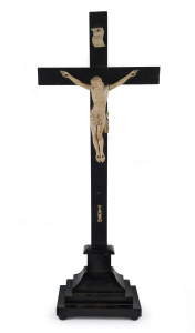 A crucifix, ebonized timber and carved ivory, 19th century, ​59cm high