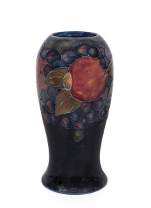 MOORCROFT "Pomegranate" pottery vase on dark blue ground, circa 1920s, impressed "Moorcroft, Made in England", 18cm high