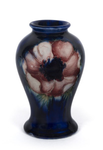 MOORCROFT "Anemone" pattern pottery vase on blue ground, circa 1930s, impressed signature mark "W. Moorcroft, Potters To H.M. The Queen, Made In England", 10.5cm high