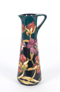 MOORCROFT floral patterned ewer, circa 2006, stamped "Moorcroft, Made In England, Stoke On Trent, 2006, J.S.", 19cm high