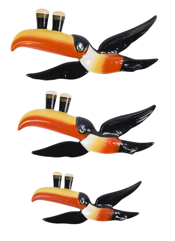 GUINNESS Carlton Ware set of three vintage flying toucan wall plaques, stamped "Carlton Ware, Hand Painted, Made In England, Trademark Registered Australian Design", ​the largest 24.5cm long