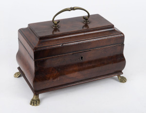 A Georgian bombe shaped tea caddy, flame mahogany with brass feet, circa 1800, 17cm high, 27cm wide, 16cm deep