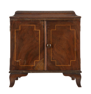 A Georgian miniature two door apprentice cabinet, interior fitted with four drawers, mahogany and satinwood, early 19th century, 31cm high, 30cm wide, 16cm deep