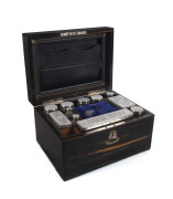A ladies travelling box, coromandel with mother of pearl inlay, interior fitted with velvet lined jewellery compartments and silver plated bottles, 19th century
