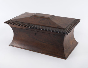An English tea caddy of waisted form with dragooned edging, rosewood with original fitted interior and glass mixing bowl, early 19th century 17cm high, 37cm wide, 23cm deep
