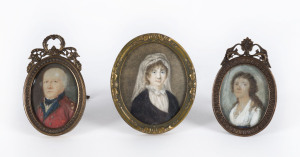 Three antique hand painted miniatures in brass frames, circa 1800, presumably mother, father and daughter, the largest 8cm x 6.5cm overall