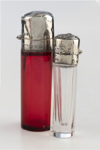 Two antique scent bottles with sterling silver tops, 19th century, 7cm and 9cm high