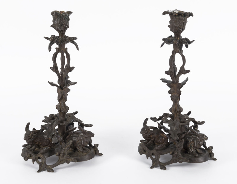 A pair of bronze candlesticks with cast rabbit figures, 19th century, ​31cm high