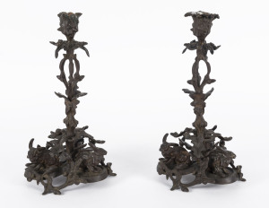 A pair of bronze candlesticks with cast rabbit figures, 19th century, 31cm high