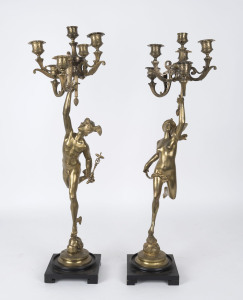 A pair of French six branch candelabra in the form of Mercury and Venus, gilt metal on wooden bases, 19th century, 73cm high