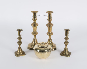 Two pairs of antique brass candlesticks together with a LIPTON'S souvenir tea caddy from the British Empire Exhibition 1925, (5 items), the tallest 26cm high