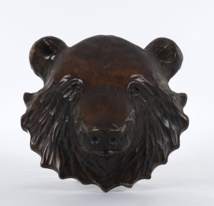 A Black Forest bear face plaque, carved wood, early 20th century, 31cm high