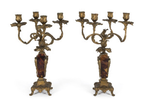 A pair of French four branch candelabra, ormolu with tortoiseshell columns, 19th century, 42cm high