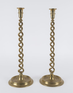A pair of antique brass candlesticks with double helix columns, 19th century, 51cm high
