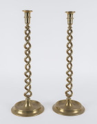 A pair of antique brass candlesticks with double helix columns, 19th century, ​51cm high