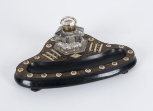 An inkpot desk set, walnut and mother of pearl with glass and brass fittings, 19th century, 33cm across