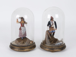 A pair of French wax figure dioramas in glass domes, early 19th century, 25cm high