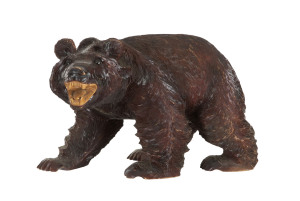 A Black Forest style carved wooden bear statue, Japanese, early to mid 20th century, ​40cm high, 68cm long