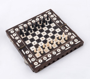 An Anglo-Indian traveling chess set, ebony and ivory, 19th century, 15 x 15cm