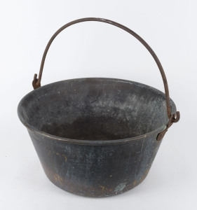 An antique copper cauldron with iron swing handle, late 19th century, 53cm diameter