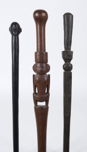 Three walking sticks with tribal carvings, Papua New Guinea and Pacific Islands, 20th century, the largest 87cm high