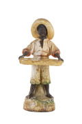 "FRUIT BOY" chalk ware statue, early 20th century, 52cm high