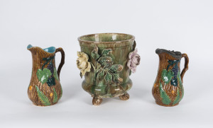 Majolica jardiniere with applied floral motif and two majolica jugs, English, 19th century, the jardiniere 25cm