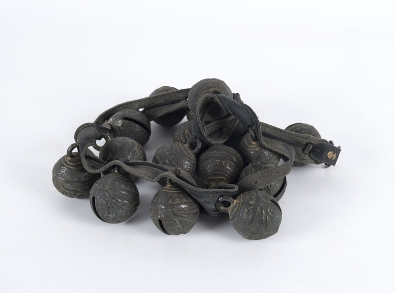 Tibetan yak or horse bells, cast bronze and leather, 19th century, ​17 bells in total, each bell 7cm high