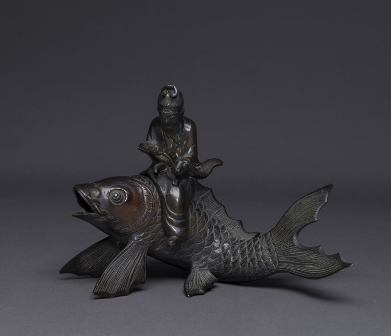 A Chinese bronze censor, Qin Gao riding a carp, Qing Dynasty, 19th century, ​17cm high, 24cm long