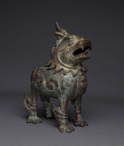 A Chinese bronze lion censor, 19th/20th century, ​32cm high