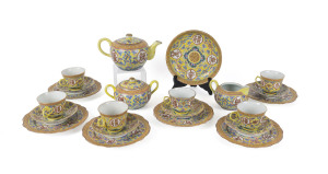 A Chinese famille rose tea set on imperial yellow ground, Guangxu mark and period, 19th century, comprising teapot, jug and bowl, six cups, sauces and plates and sweetmeat dish