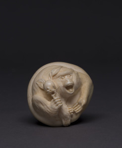 A Japanese netsuke carved ivory in the form of a monkey, signed "Himiko", ​5.5cm across