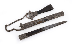 A Tibetan dagger, finely worked silver mounts on wood and steel, 19th century, 25cm in scabbard