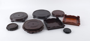 Five Chinese stands, 20th century, the largest 28cm diameter