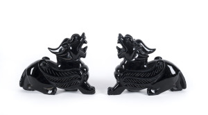 A pair of Peking glass lion statues, circa 1930s 19cm high, 20cm long