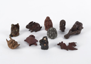 Ten assorted Chinese and Japanese figures including ivory netsuke, boxwood hare and eagle, two cast metal Buddha statues, carved wooden fish and three resin figures. the eagle 4.5cm high
