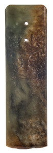An archaic green jade axe head engraved with a pig-faced deity, Vietnamese,